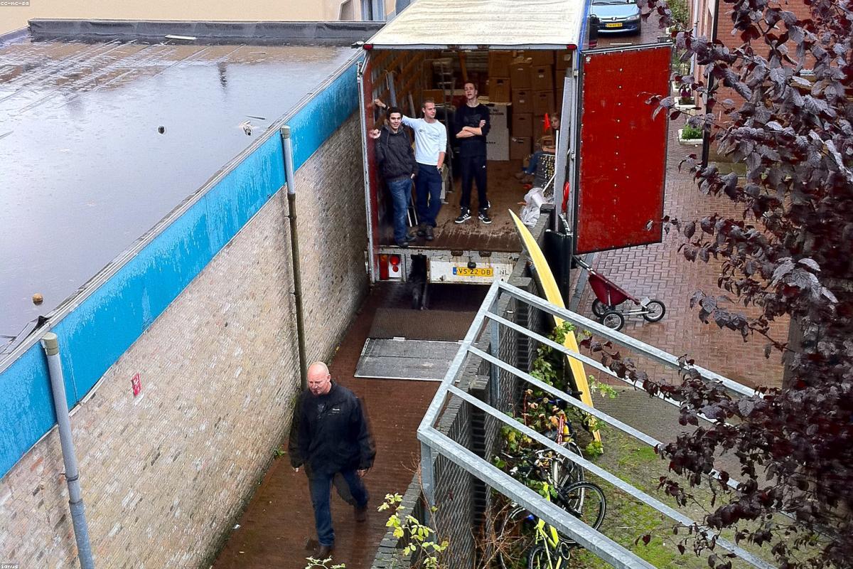 Moving crew unloading a truck at a loading dock