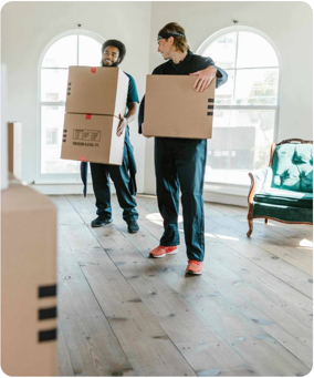 Two movers carrying moving boxes